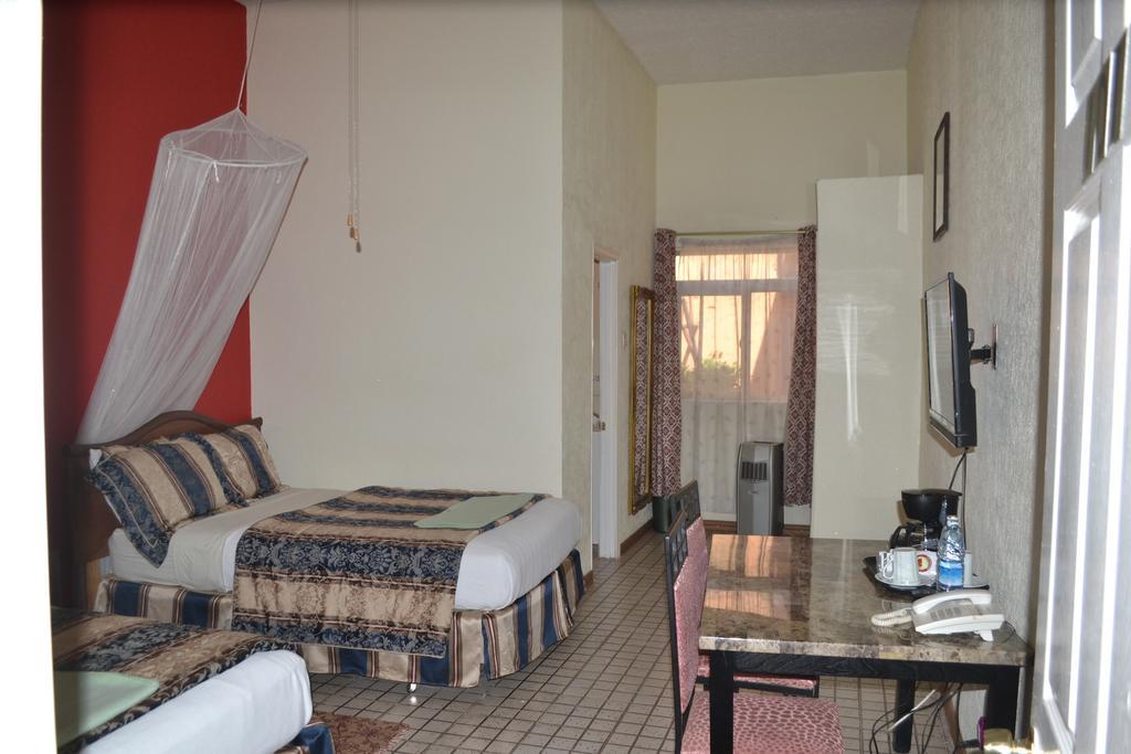 Executive Airport Hotel Энтеббе Номер фото